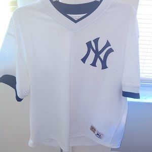 This is a men Mitchell & Ness New York mesh Jersey. Size XL . White and black